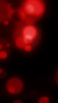 Soft red glowing bokeh circles on a dark background, creating a moody abstr.. 库存插图