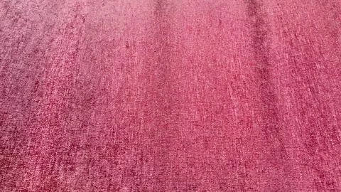 Soft red satin fabric draped elegantly with smooth folds Vídeo Stock 317177748
