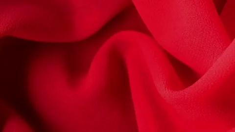 Soft red satin fabric texture background, elegant textile folds, luxury material Stock Footage 336190422