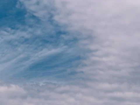 Soft rippled clouds spreading across blue sky, natural abstract background Photos