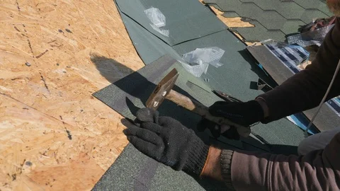 Soft roof of shingles. Repair of the roof of a residential house. installation Stock Footage