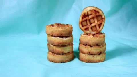 Soft round breakfast waffles move around the table Stock Footage 159720674
