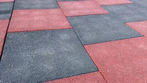 Soft rubber tiles on the Playground. Grey and red color Stock Footage 166314158