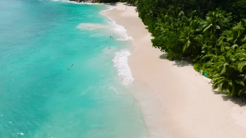 Soft sandy beach and crystal-clear turquoise water. Seychelles, Mahe. Stock Footage 311137277
