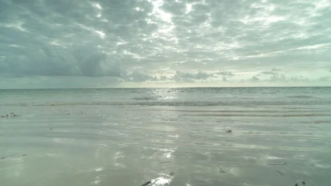 Soft sea waves approaching the seacoast on a cloudy day Video stock 85791034