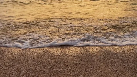 Soft sea waves with golden light at sunset Stock Footage 346539719
