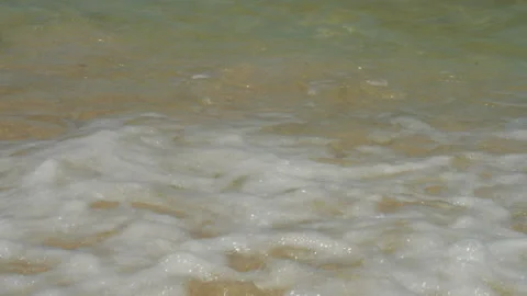 Soft sea waves rushing on the sandy beach at the sunset Stock Footage 86416199