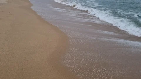 Soft sea waves washing smooth sandy shoreline on a calm day Stock Footage 322093015