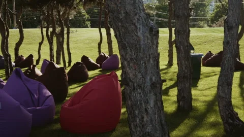 Soft seats are located on the lawn in the recreation area in the park Stock Footage 341437213
