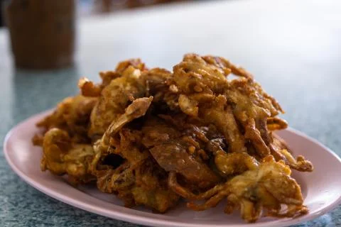 Soft Shell Crab fried with garlic on plate in restaurant. Stock Photos
