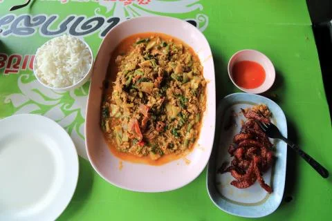 Soft Shell crab in a yellow egg thai curry. Stock Photos
