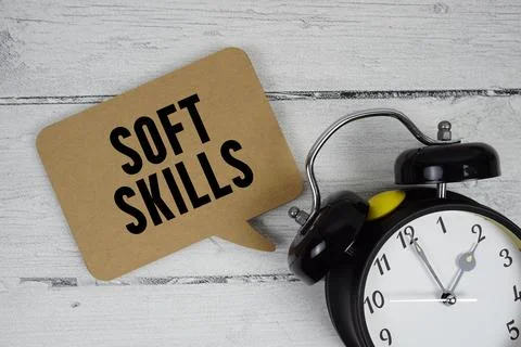 Soft Skills text with alarm clock on wooden background Stock Photos