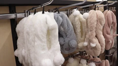 Soft slippers in the form of animals in the store. Fur slippers Stock Footage 243682484