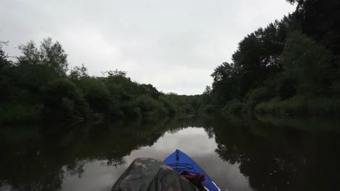 Soft, slow floating background view from a boat on a green river in the UK Video stock 137207896