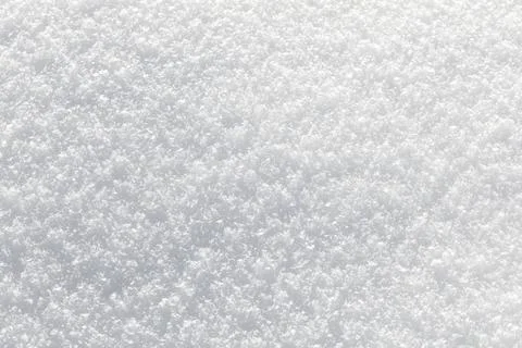 Soft snowflakes blanket the ground in pristine white Stock Photos