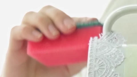 Soft Sponge Touch on Elegant Lace Mug During Daytime Care Stock Footage 340594223