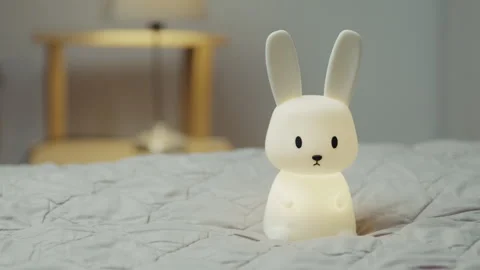 Soft squishy rabbit LED lamp, BPA-free silicone nightlight for nursery and baby  Video stock 330433624