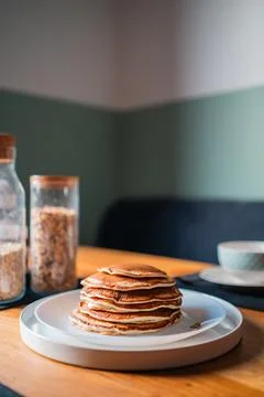 Soft Stack of Delicious Pancakes on a White Plate for Breakfast with Cereals Stock Photos