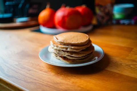 Soft Stack of Pancakes on a Plate Placed on A Wooden Table with Hokkaido Pu.. Stock Photos