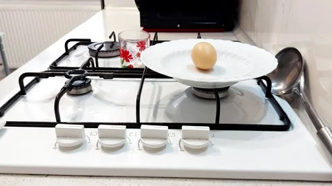 Soft Start: Placing Boiled Eggs in Morning Light for Gentle Prep 스톡 동영상 315493330