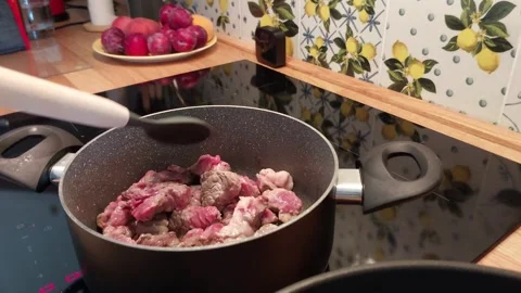 Soft Steam and Sizzling Meat: A Quiet Culinary Ritual Stock Footage 314100166