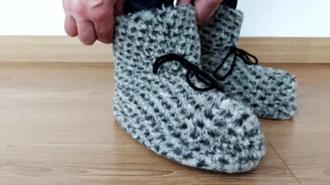 Soft Steps: Hand-Knit Slippers for Gentle Mornings and Cozy Nights Stock-Footage 315285789
