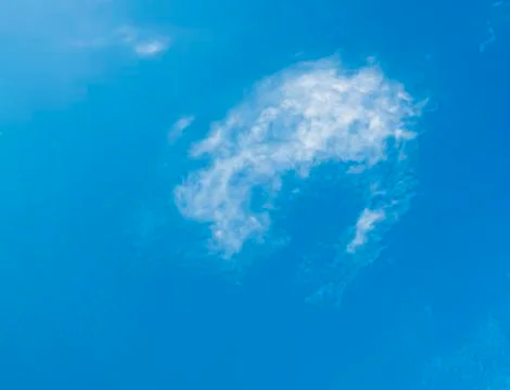 Soft summer cloud on blue sky Stock Photos