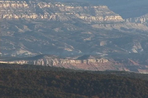Soft Sunlight and Shadows on Steep Red-Banded Cliffs in Utah Stock Footage 121615457