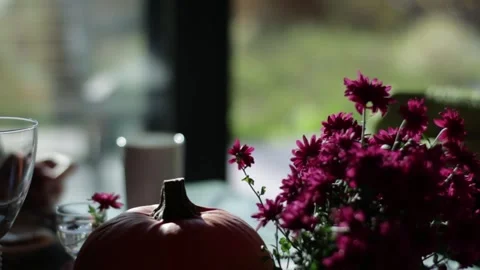 In soft sunlight, a blurred woman eats, creating a cozy interior scene. Stock Footage 294363894