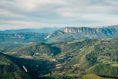 Soft sunlight at the end of the afternoon over the mountains Stock Photos