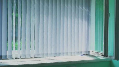 Soft sunlight filtering through white window blinds Stock Footage 295954871