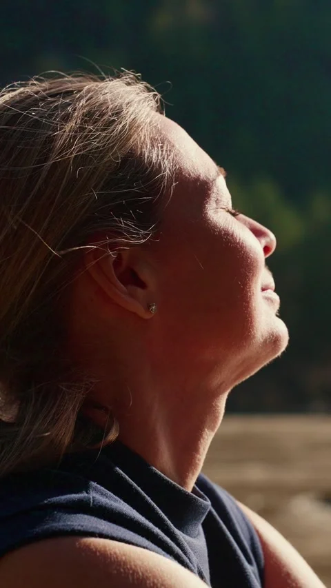 Soft sunlight glows on her face Stock Footage 333903361