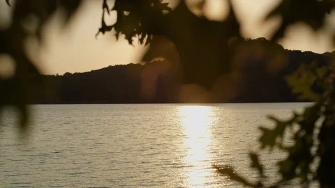 A Soft Sunlight Reflects Off A Lake Stock Footage 87396978