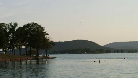 A Soft Sunlight Reflects Off A Lake Stock Footage 87397002