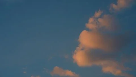 Soft Sunset Clouds Against Blue Sky Stock Photos