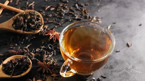 Soft tea cup focus Pour hot tea into the teacups placed on the table in slow mot Stock Footage 201917043