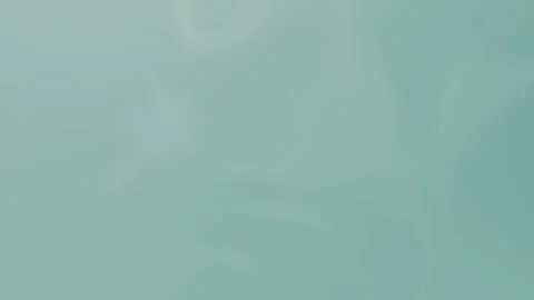 Soft teal backdrop with blurred swirls. Seamless loop background in 4K. Vídeo Stock 309956811