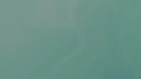 Soft teal gradient with subtle wavy patterns, seamless loop background. 4K. Stock Footage 310143514