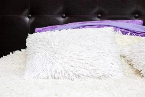 Soft textures and warm lighting, Modern bedroom with plush pillow and elegant Stock Photos