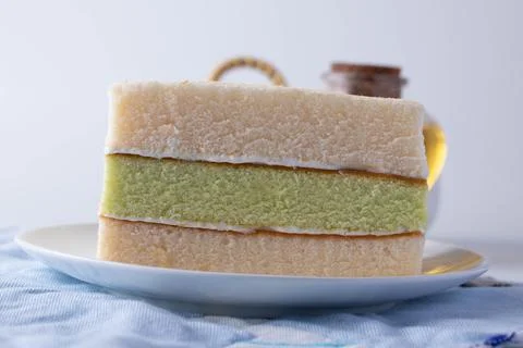 Soft three layers vanilla cake in a white plate Stock Photos
