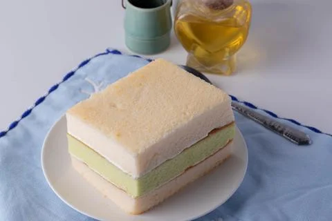 Soft three layers vanilla cake in a white plate Stock Photos