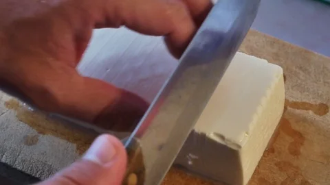 Soft tofu while was cutting for cooking korean food-Soft tofu stew Stock Footage 128795786