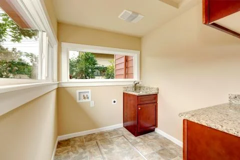 Soft tones empty laundry room Stock Photos