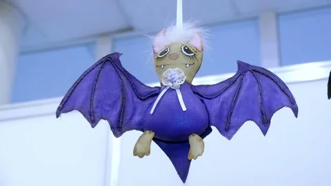 Soft toy bat suspended from the ceiling Stock Footage 83376526