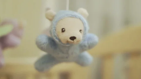 Soft toy bear over the lullaby newborn Stock Footage 87918127