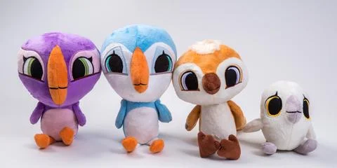 Soft toy. Group of multi-colored bird chicks on a white background. Stockfoto's