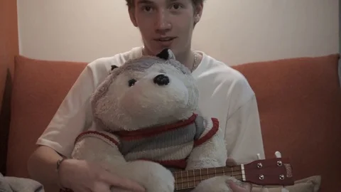 Soft toy wolf plays the guitar Stock Footage 127750779