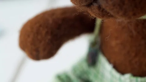 Soft toy of wool (felt) handmade: brown (chocolate) cute dog. Stock Footage 79449533