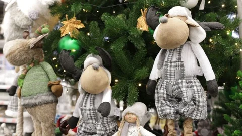 Soft toys doll for a gift on a background of green spruce. Decorative toy as a s Stock Footage 121108230