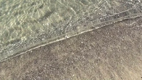 Soft transparent waves of sea water on the sandy beach. Stock Footage 77338826